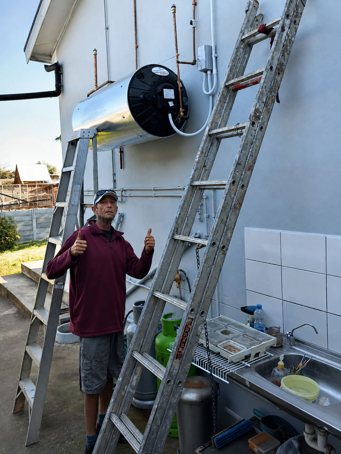 Hilton giving a thumbs up after a successful plumbing inspection